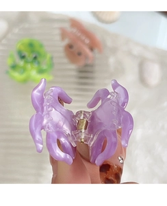 Detailed macro view of the small lavender octopus acetate hair claw clip for side hair
