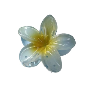 Elegant translucent blue frangipani flower hair claw clip with vibrant yellow center
