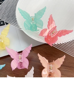 Assorted colorful butterfly hair clips with translucent acrylic wings and metal spring