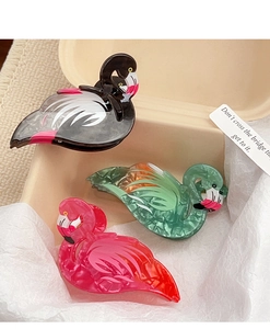 Detail view of flamingo hair clips in marble texture acetate and candy colors