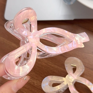 Grandes pinces à cheveux en forme de nœud couleur gelée aux reflets rose et blanc
