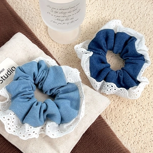 Denim fabric scrunchies with white lace trim in light and dark blue for ballet core style