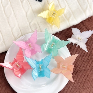 Colorful acrylic butterfly hair claws with textured wings and strong metal springs