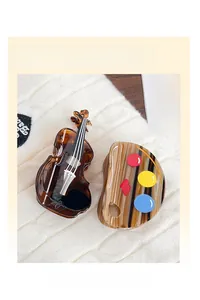 Close-up of retro acetate hair claws in cello and palette shapes with amber texture