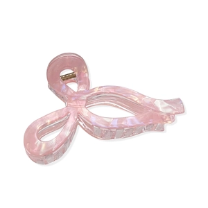 Grande pince à cheveux rose nacré en forme de nœud avec ressort métallique doré