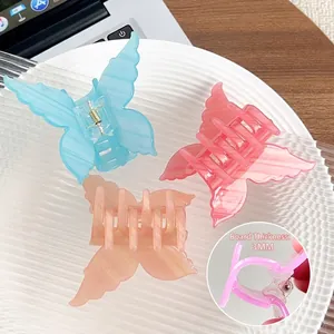 Three gradient butterfly acrylic hair claws in blue, orange, and pink colors