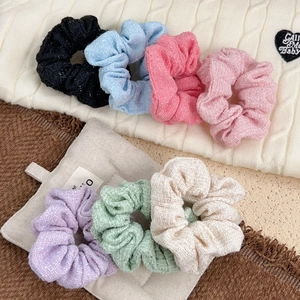 7-pack of multi-colored tweed scrunchies set including pink blue and black hair ties