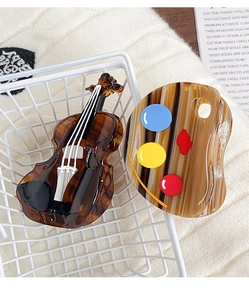 Detailed close-up of acetate hair claws in cello and palette artistic shapes