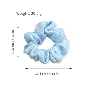 Light blue textured fabric scrunchie with 10.5cm diameter measurement display