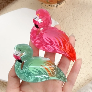 Pink and mint green flamingo hair claws in marble acrylic for elegant ponytails