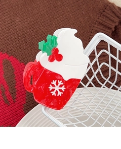 Details zur weihnachtlichen Haarklammer in Becherform mit Schneeflocken und Stechpalme