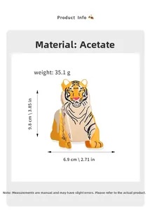Macro view of a tiger-shaped acetate hair claw clip with detailed orange and black textures