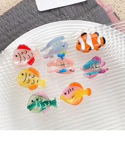 Detailed top view of assorted mini sea animal acetate hair claws in various vibrant colors
