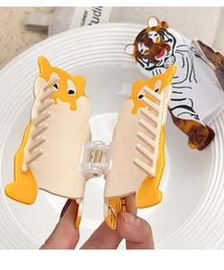 Close-up of acetic acid tiger and dog hair claws with sturdy metal spring mechanism