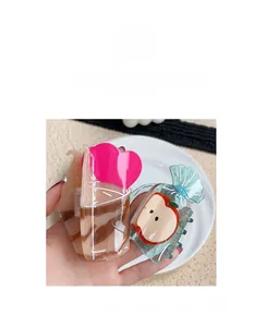 Detailed shot of creative heart and apple shaped acetate hair claws in high gloss finish