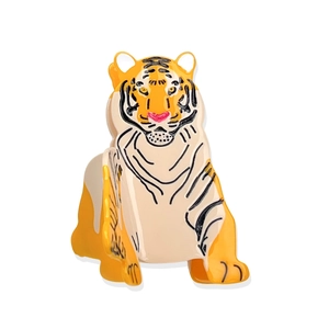 Tiger-shaped acetate hair claw clip with orange and black stripes on white background
