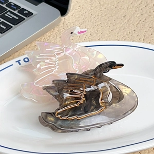 Elegant swan acetate hair claw clips in pearlescent pink and marble grey for women