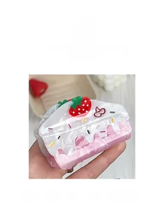 Close-up of strawberry cake claw clip featuring 3D strawberries and colorful sprinkles