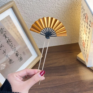 Golden fan-shaped hair fork with black accents and U-shaped pin in classic Chinese style