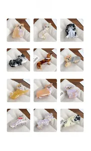Catalogue de douze pinces à cheveux en acétate aux motifs de diverses races de chiens
