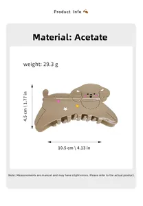 Detail view of khaki acetate puppy hair claw clip showing size and weight specs