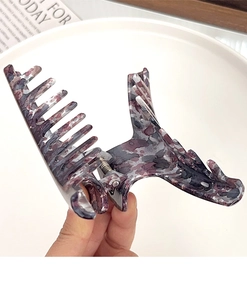 Detail of large marble pattern hair claw clip with vintage purple and grey ink texture