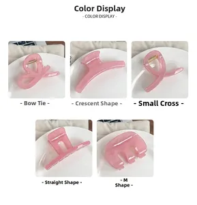Set of five pink jelly hair clips in various shapes on a white ceramic plate detail