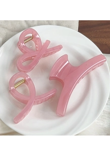 Three-piece set of translucent pink resin hair claws in assorted sizes and styles