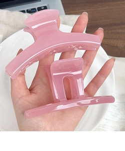 Set of two jelly pink hair claws including large curved and medium square clips