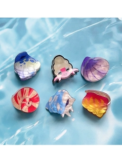 Set of 6 ocean-themed acrylic hair claws featuring colorful shells and hermit crab shapes