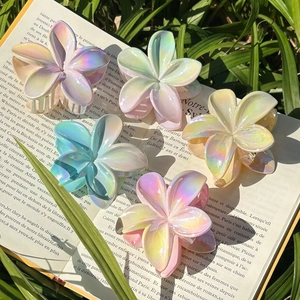 Five-piece set of iridescent Plumeria flower hair claws in assorted pastel gradient colors