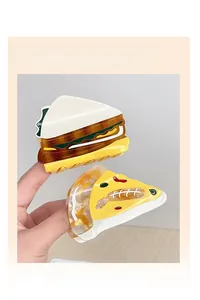 Detail of creative acetic acid hair claw clips in sandwich and pizza food shapes