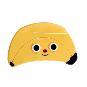 Cute yellow banana hair claw clip with cartoon face design made of acetate material