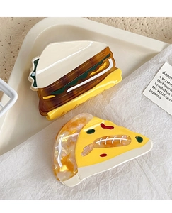 Detailed view of handmade acetate hair claws in realistic sandwich and pizza food shapes