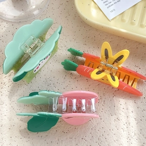 Cartoon broccoli and carrot acetate hair claw clips for women on a beige texture background