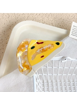 Detailed view of pizza-shaped acetate hair claw clip with realistic shrimp and cheese design