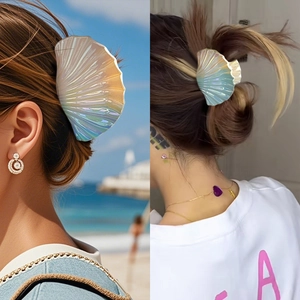 Iridescent seashell hair claw clip with pearlescent finish for summer beach styling