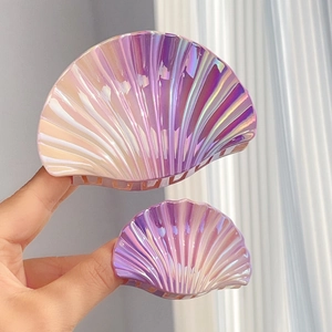 Pearlescent seashell hair claw clip with purple gradient finish and shiny luster