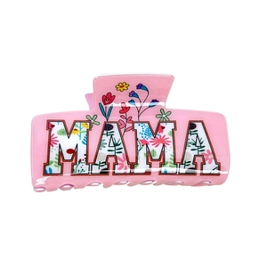 Pink rectangular MAMA claw clip with floral pattern letters on a clean white background