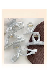Set of silver glitter hair claw clips in various geometric shapes for elegant styling