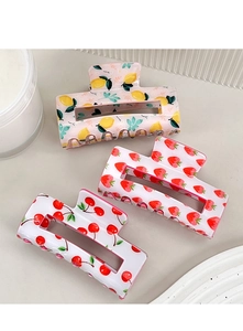 Three acrylic fruit hair claws featuring lemon strawberry and cherry pattern in a row