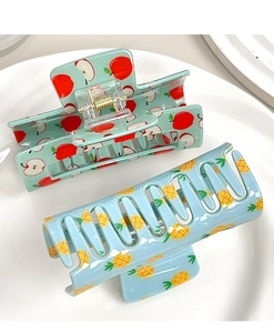 Detail of apple and pineapple fruit pattern hair claws with strong metal spring