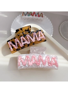 Detail of MAMA lettering on marble and tortoiseshell pattern large hair claw clips