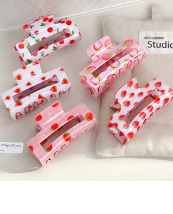 Detailed set of medium square hair claws featuring cherry and watermelon fruit patterns