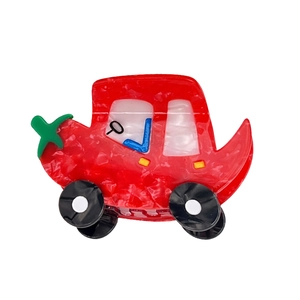 Haarklammer in Auto-Form aus Acetat mit roter Marmorierung und grünem Stern-Detail