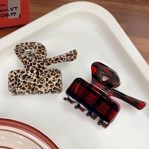 Korean style leopard print and red plaid acetate claw clips set on a tray