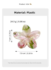 Detailed view of floral hair claw clip showing marble texture and 7cm x 7.9cm dimensions