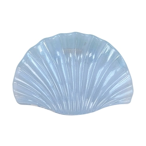 Glossy light blue seashell hair claw clip with pearlescent finish and fan-shaped stripes