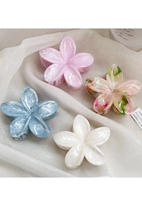 Detailed shot of large acetate floral hair claws with marble texture in various colors
