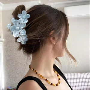 Light blue floral shark hair claw clip for women featuring elegant mother-of-pearl finish